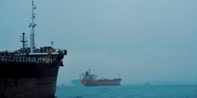 View of Cargo Ship and Tanker on the Sea in Fog